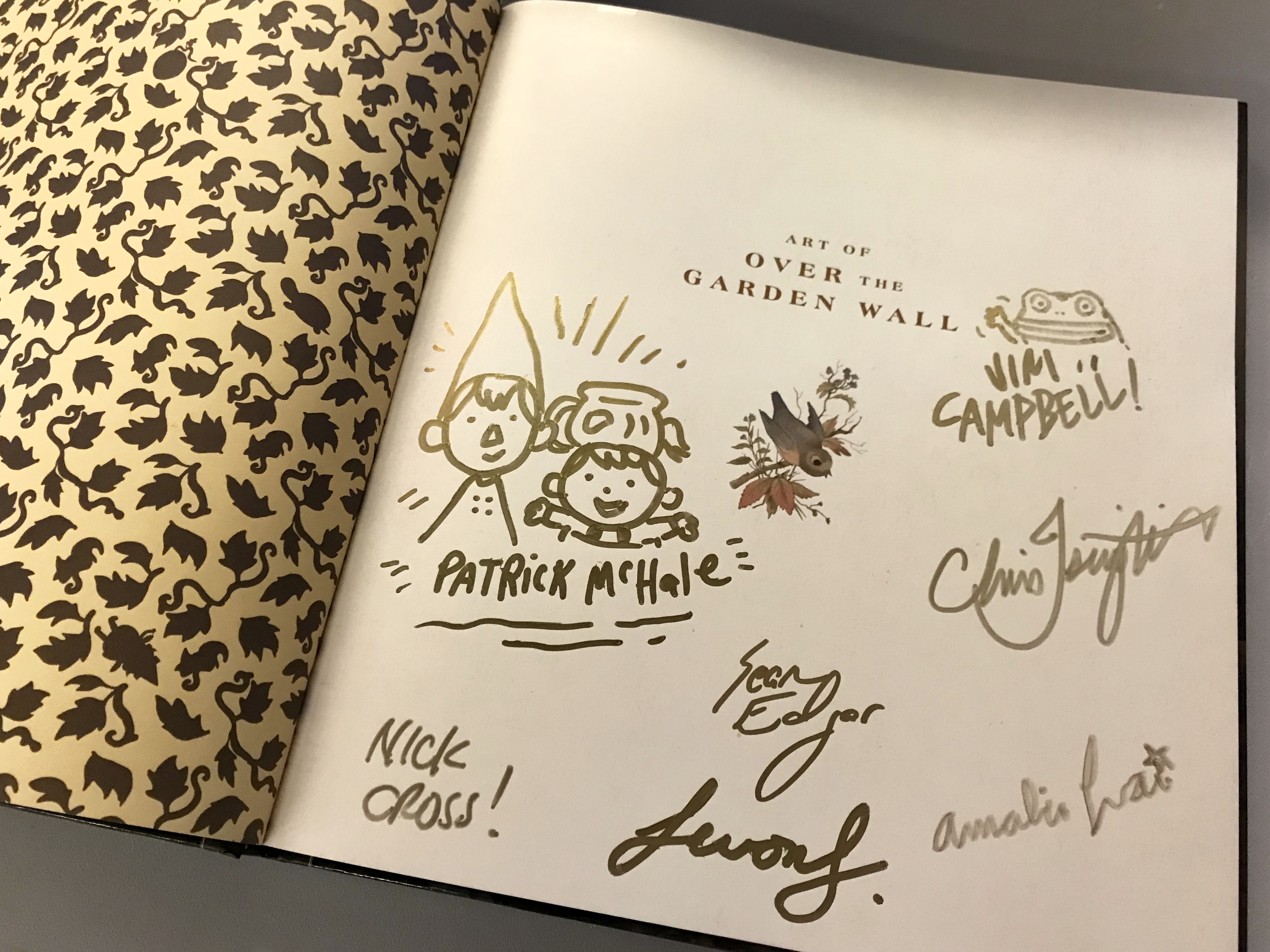 The special giveaway copy of The Art of Over the Garden Wall, signed by creators!